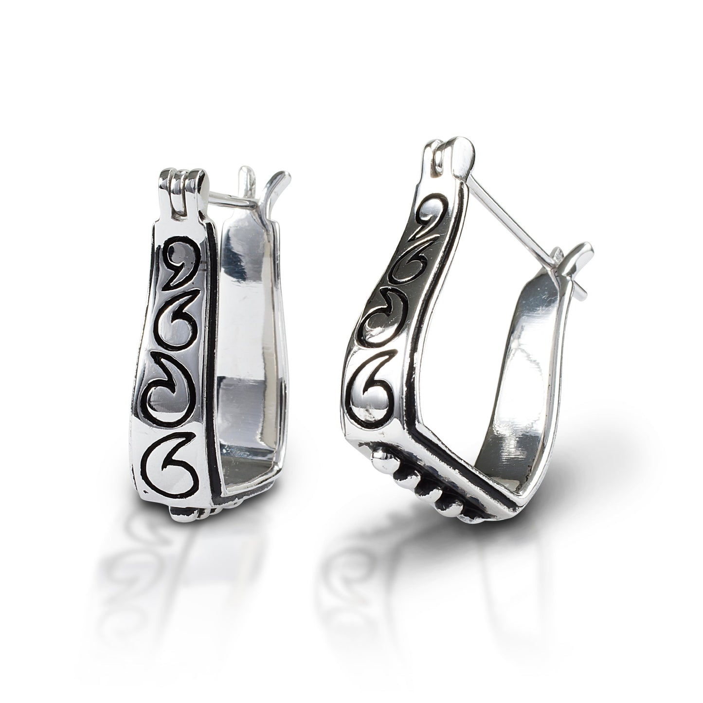 Silver Kelly Herd horseshoe earrings with intricate scroll designs.