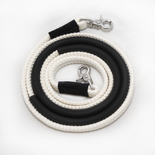 Thinline white and black coiled rope with metal clasp.