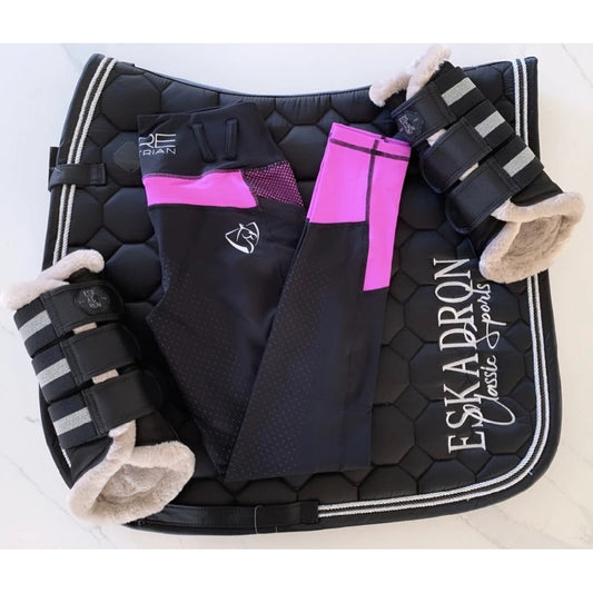 Black horse riding tights with pink detail on saddle pad.