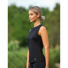 Woman in black sleeveless top, possibly wearing horse riding tights.