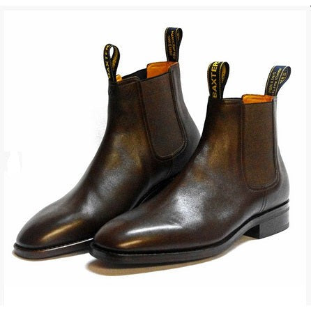 Baxter Boots brand, brown leather Chelsea boots on white background.