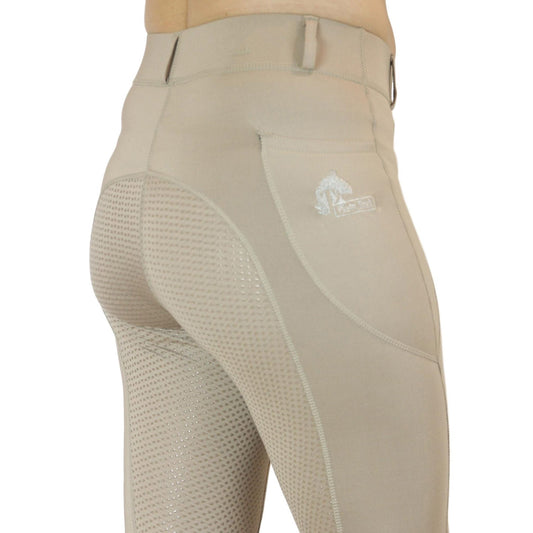 Person wearing beige horse riding tights with mesh detailing.