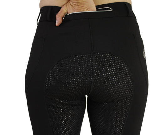 Close-up of black horse riding tights with grip pattern on seat.