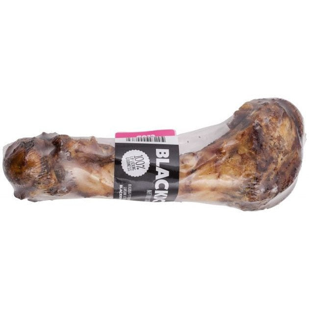 Blackdog brand large smoked bone for dogs with label, isolated.