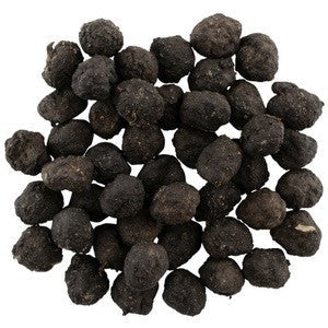 Alt text: Heap of Blackdog brand black-colored truffle pieces isolated on white.