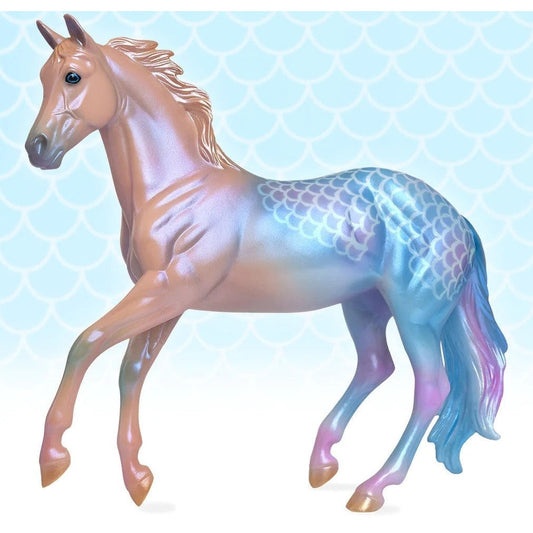 Breyer Horse Toy with iridescent scales and mane on aqua background.