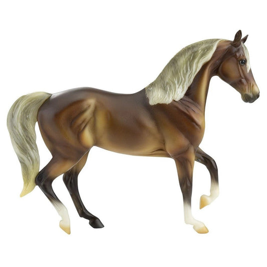 Breyer Horse Toy brown model with cream mane and tail isolated.