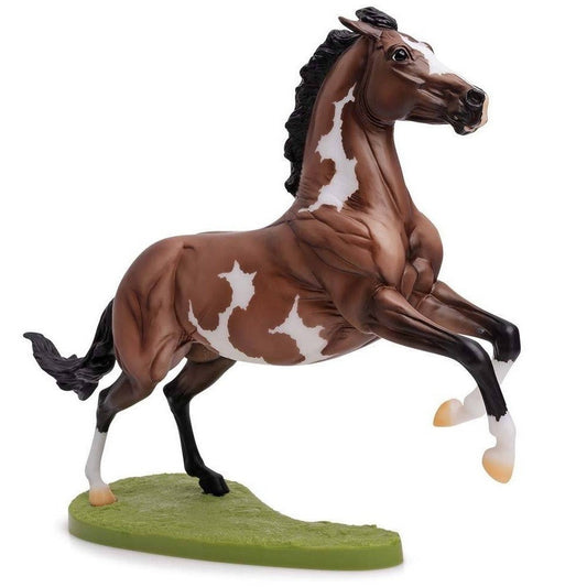 Breyer Horse Toys brown and white model horse in rearing pose.