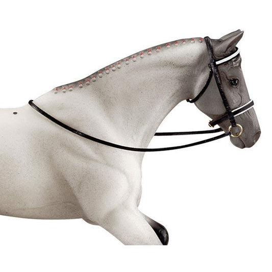 Breyer Horse Toys model of a white horse with bridle, profile view.