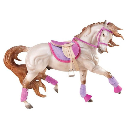 Breyer Horse Toy model galloping, with purple saddle and accessories.