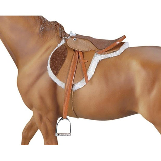 Close-up of Breyer Horse Toys model with detailed saddle and stirrup.