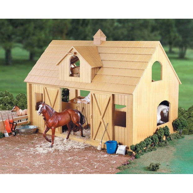 Breyer Horse Toys stable with model horses and accessories displayed.