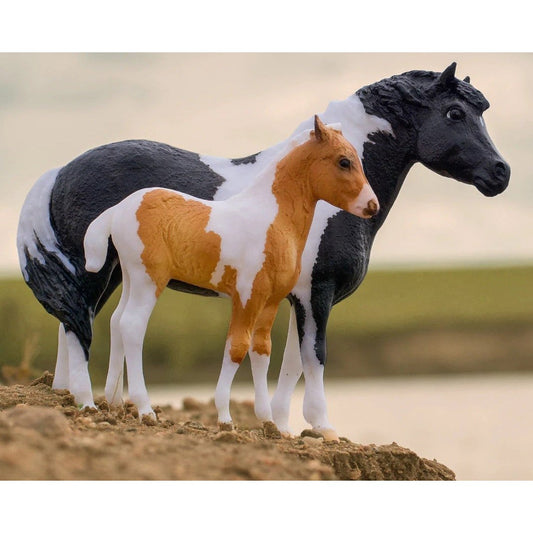 Breyer Horse Toys models, black and white mare with foal.