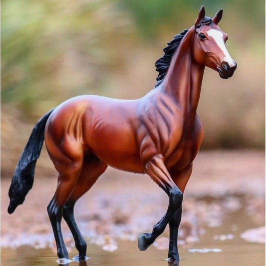 Breyer Horse Toys figurine of a bay horse with black mane.