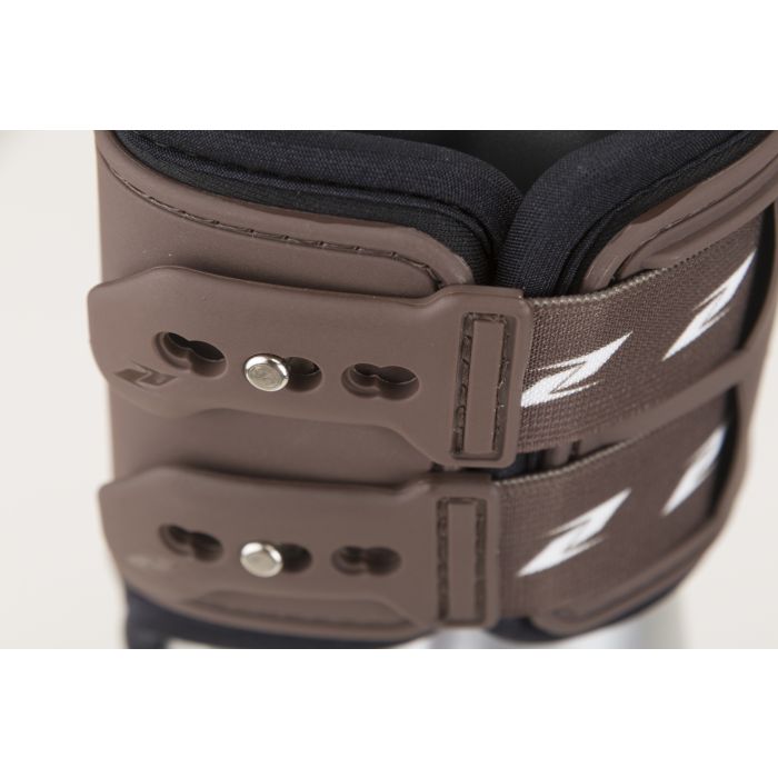 Close-up of Zandona horse boots showing adjustable straps and logo.