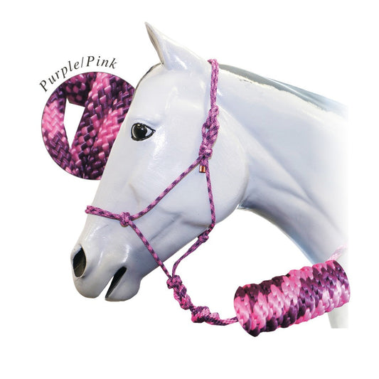 White horse mannequin head with a purple and pink rope halter.