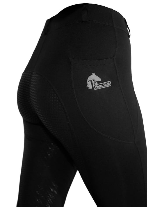 Close-up side view of black horse riding tights with logo.