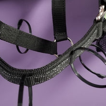 Close-up of Thinline black straps with purple background.