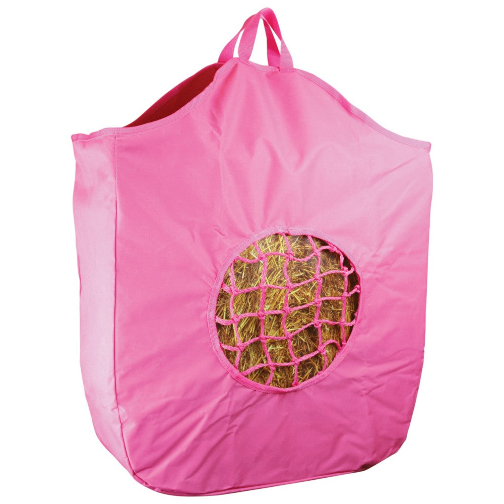 Pink hanging hay feeder bag with visible hay through round hole.
