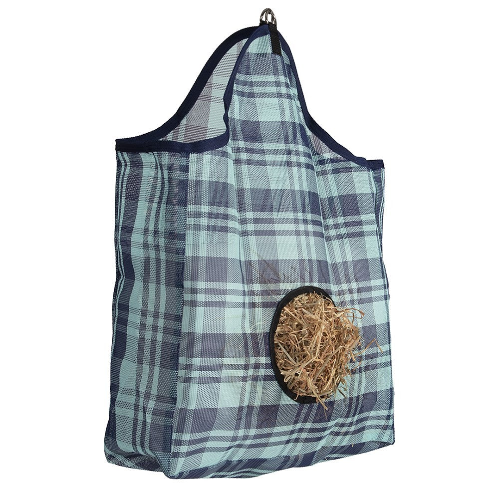 Blue plaid hanging hay feeder with hay visible through hole.