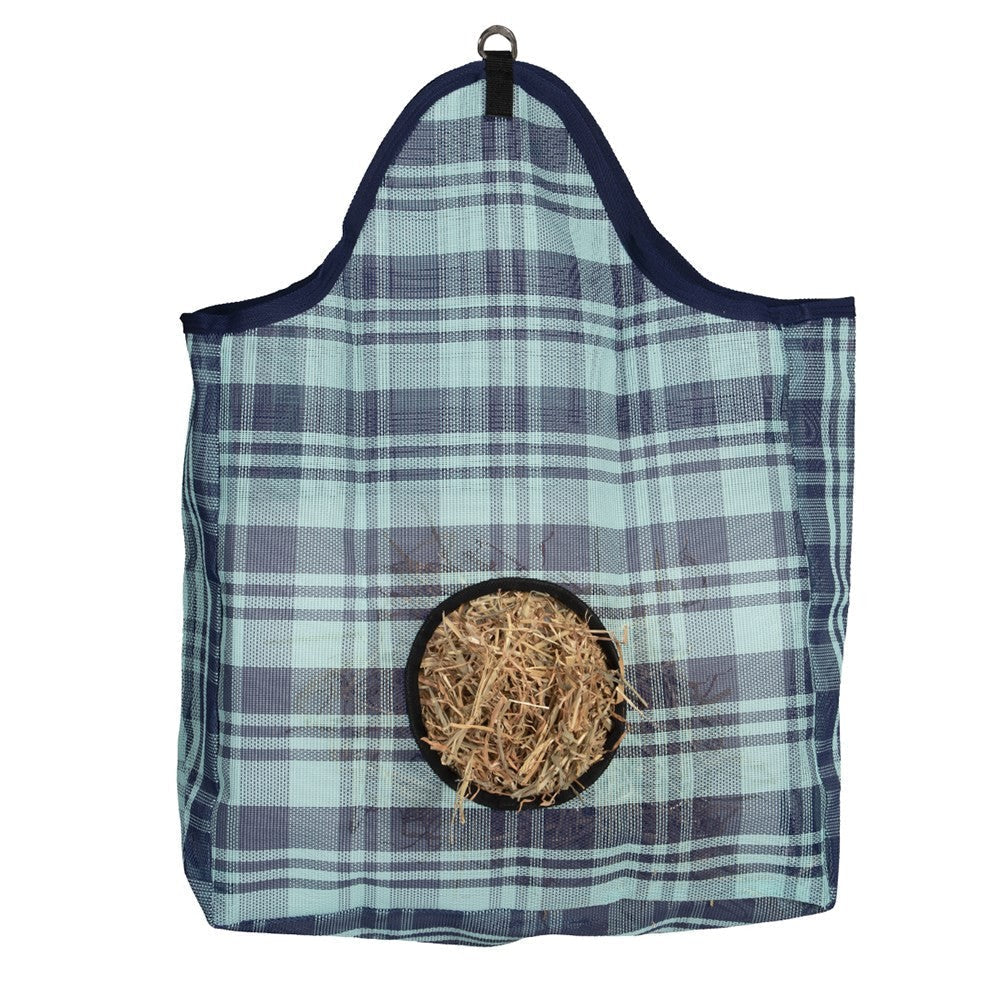 Blue plaid hanging hay feeder with hay on white background.