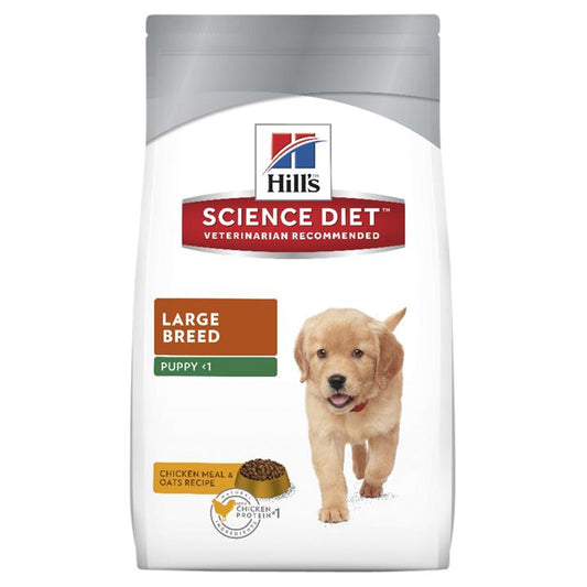 A bag of Hill's Science Diet Large Breed Puppy food with a picture of a golden retriever puppy on it, labeled as chicken meal & oats recipe.