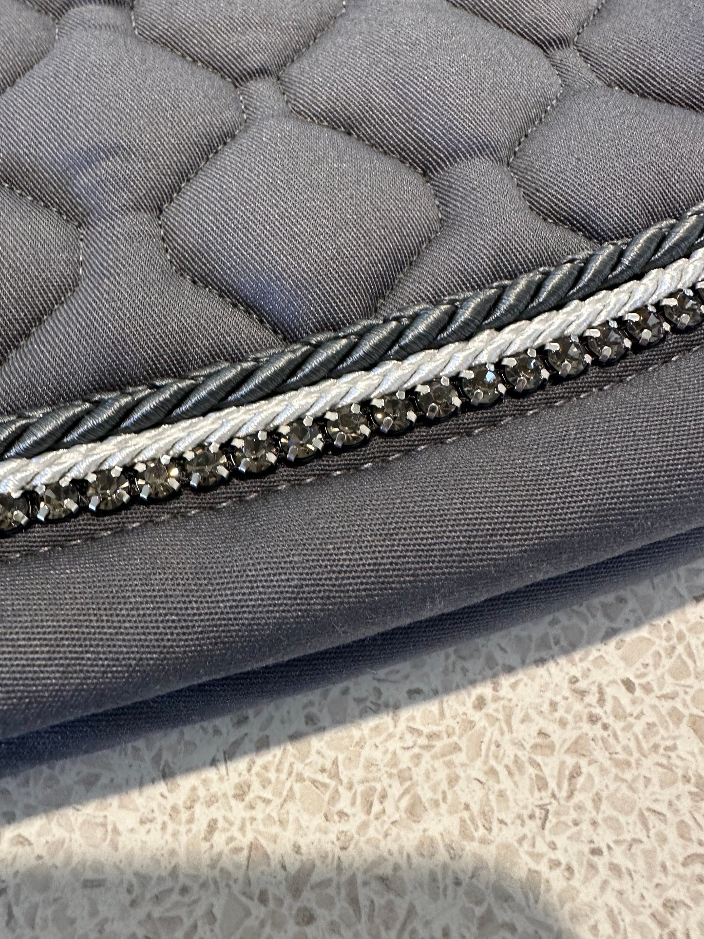 Anna Scarpati saddle pad with crystal detail and braided cording.