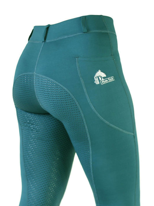Teal horse riding tights with grip pattern and small logo.