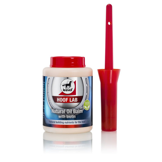 A container of HOOF LAB Natural Oil Balm with biotin, alongside a red application brush, against a white background.