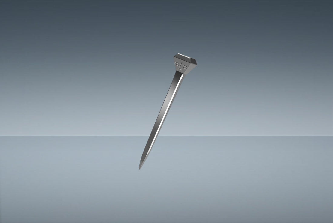 Stainless steel nail gripped in a vice against a gradient background.