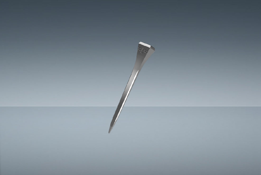 A metallic tuning fork floating against a gradient blue background.