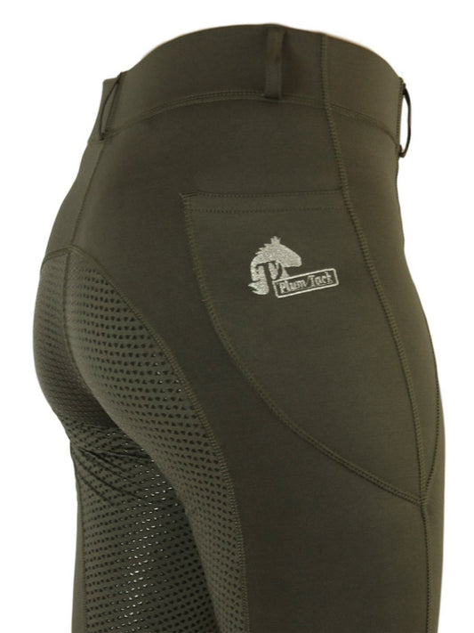 Close-up of dark green horse riding tights with mesh panels.