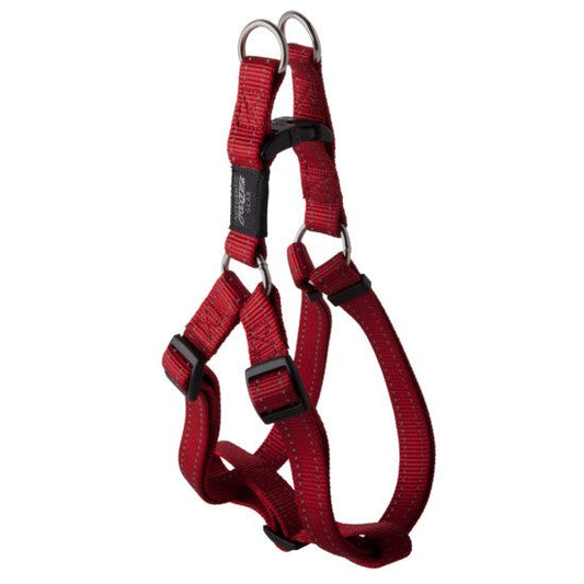 Rogz red adjustable dog harness on white background.