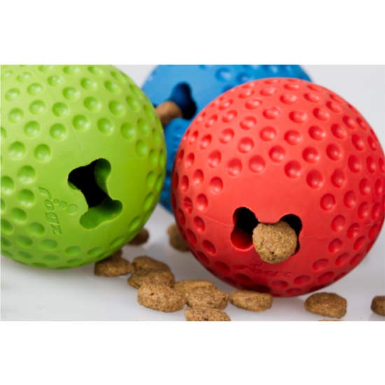 Rogz brand green and red textured dog balls with treats.
