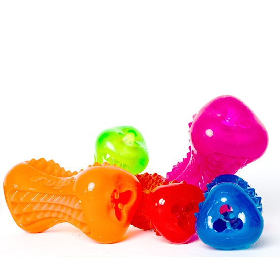 Assorted colorful Rogz dog toys on white background.