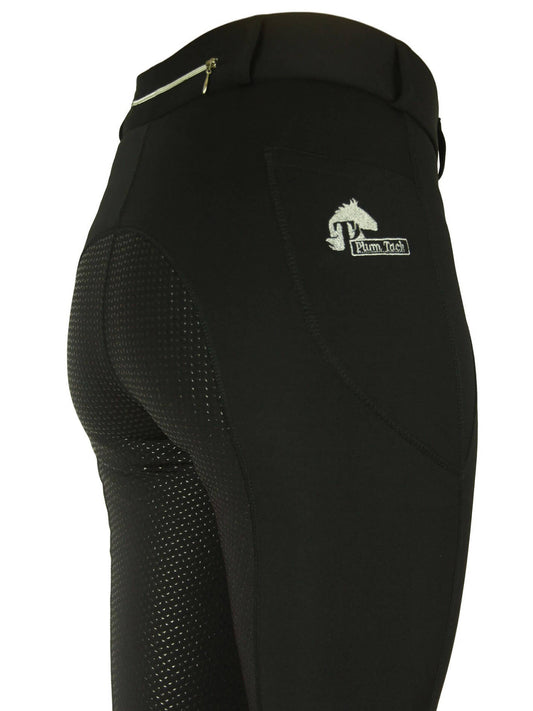 Close-up of black horse riding tights with a mesh panel and logo.