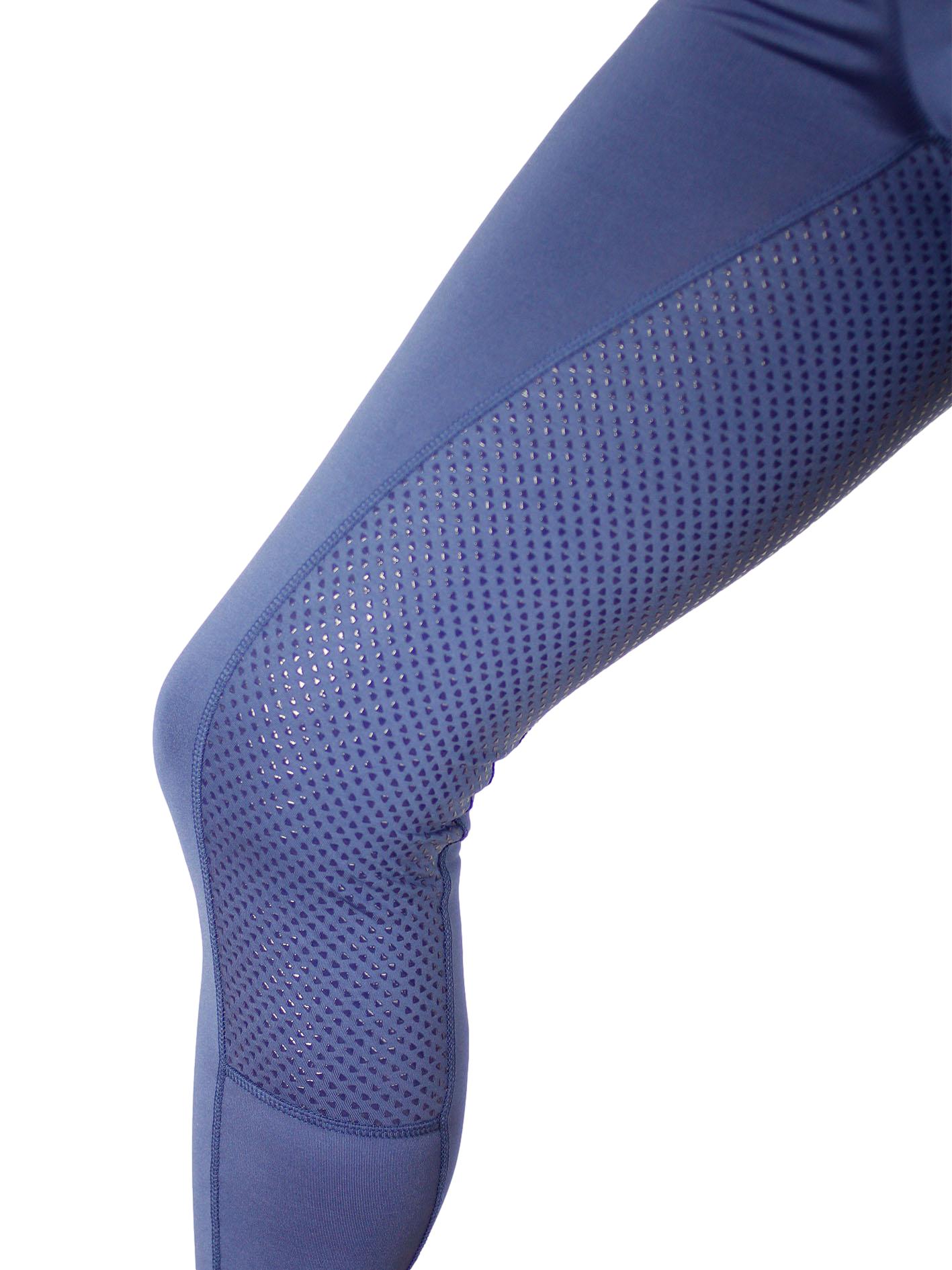 Close-up of blue horse riding tights with ventilated thigh panels.