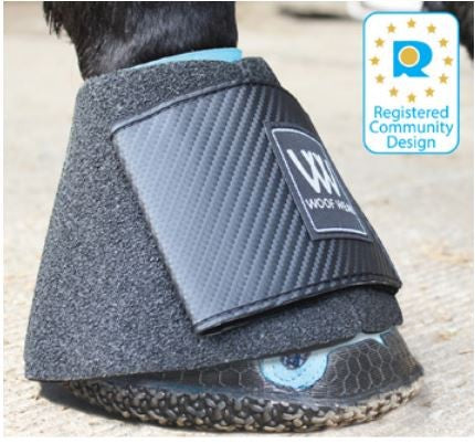 Horse's leg wearing a Woof Wear branded protective boot.