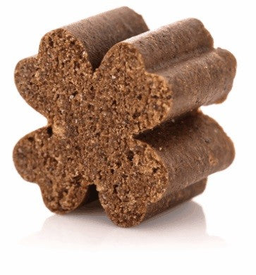 Zamipet dog treat, bone-shaped, stacked, brown, natural ingredients.