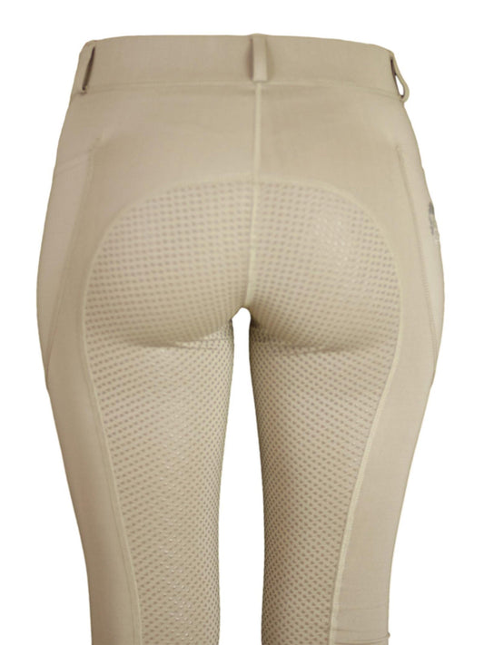 Close-up of beige horse riding tights with grip pattern detail.