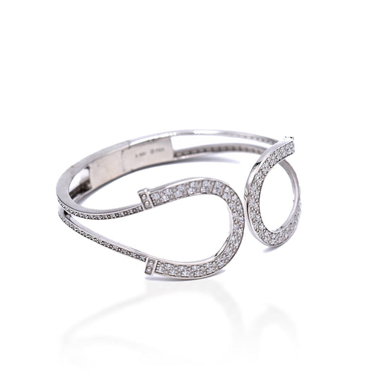 Kelly Herd silver horseshoe bracelet with sparkling stones on white.