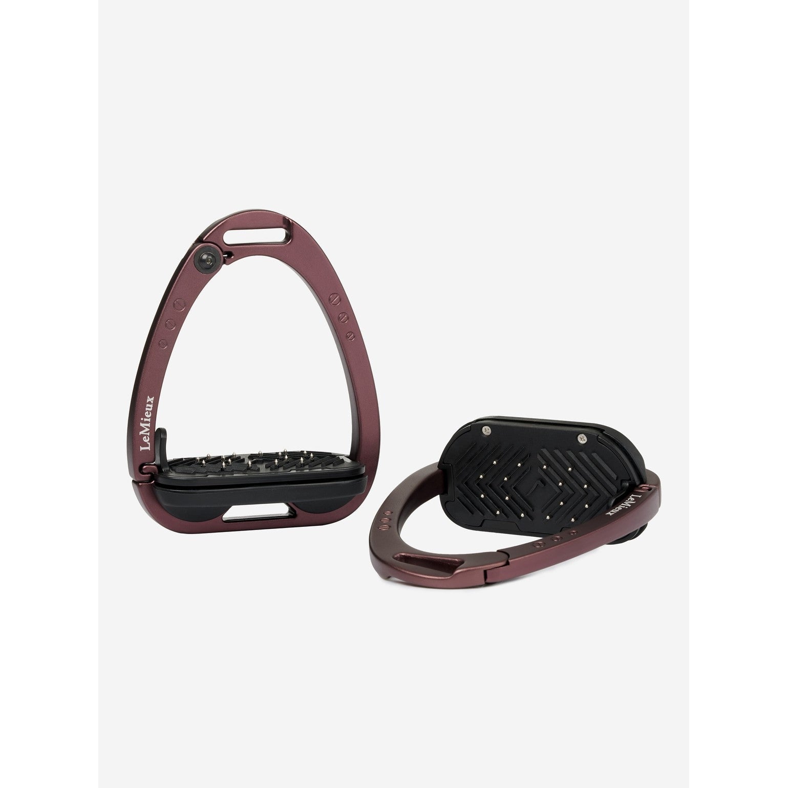 Brown stirrup leathers with black footbeds on a white background.