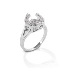 Kelly Herd silver horseshoe ring with diamonds on white background.