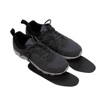 Thinline gray athletic shoes with black insoles on display.